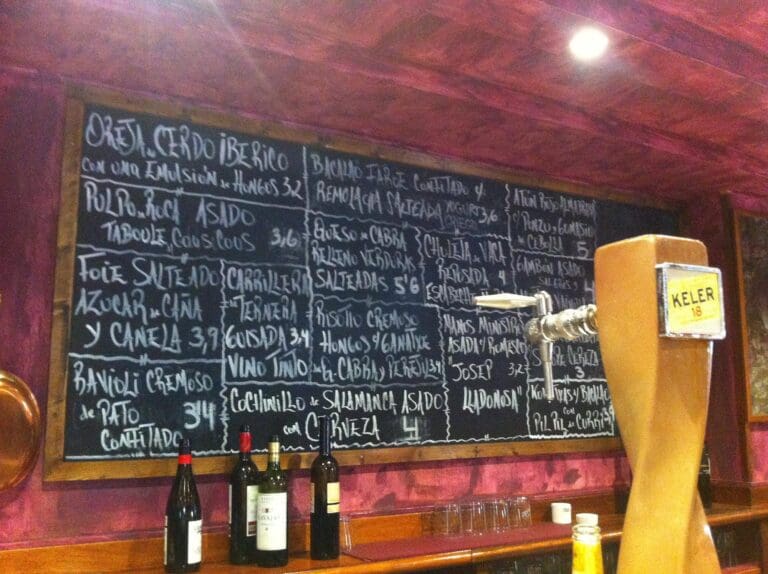 Handwritten chalkboard menu at La Cuchara de San Telmo pintxos bar in San Sebastián