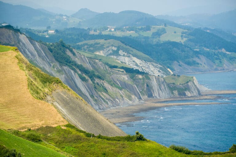 ncient flysch rock formations with horizontal geological layers in the coastal cliffs at Zumaia, Basque Country