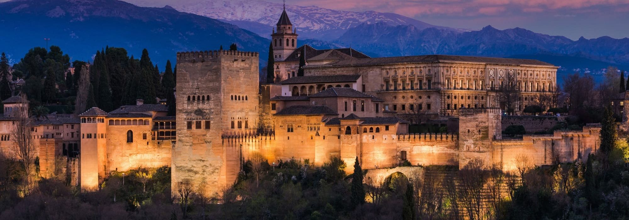 Alhambra Arabic Palace in Granada,Spain Illuminated at Twilight. Sunset Over Alhambra